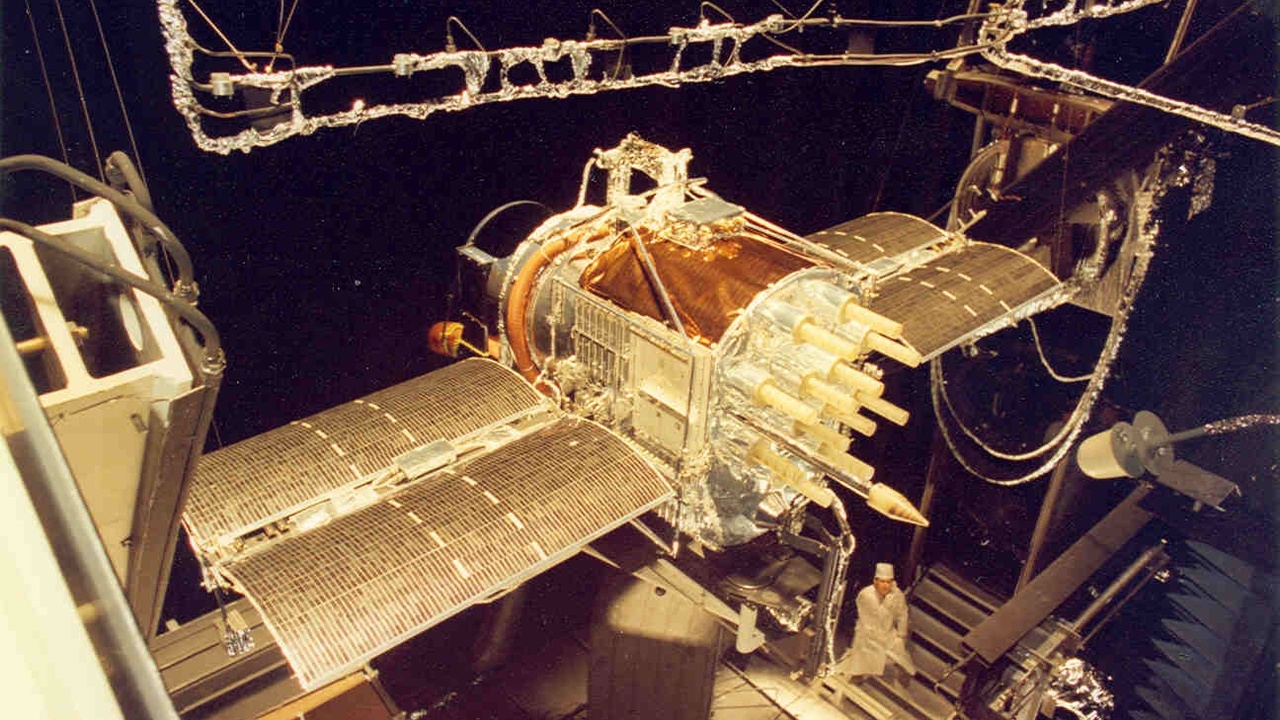 GPS satellite and ground antenna representing navigation and satellite communications