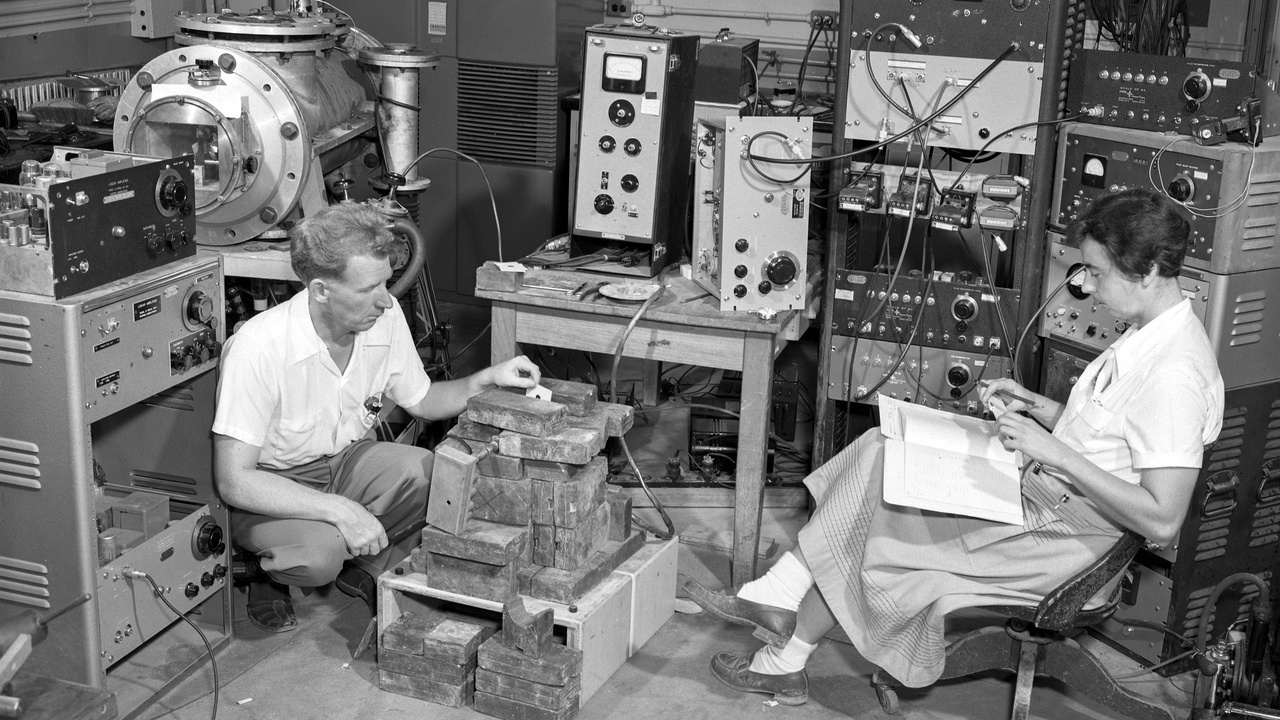 Neutron imaging setup and scientists at a scattering beamline