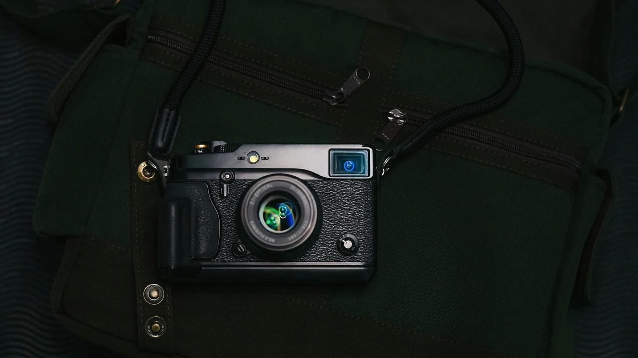 Assortment of camera gear including zoom and prime lenses