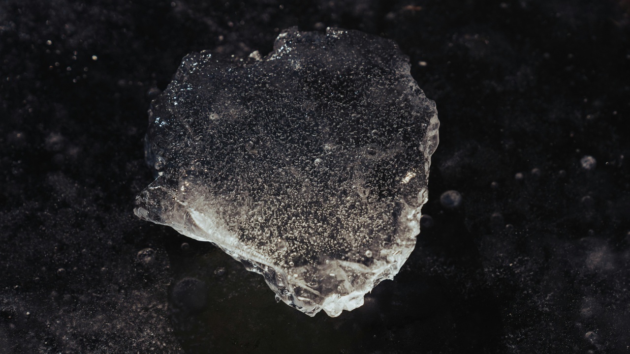 Close-up of metal surface showing layered oxide scales and localized sulfide and chloride corrosion products on nickel alloy samples.