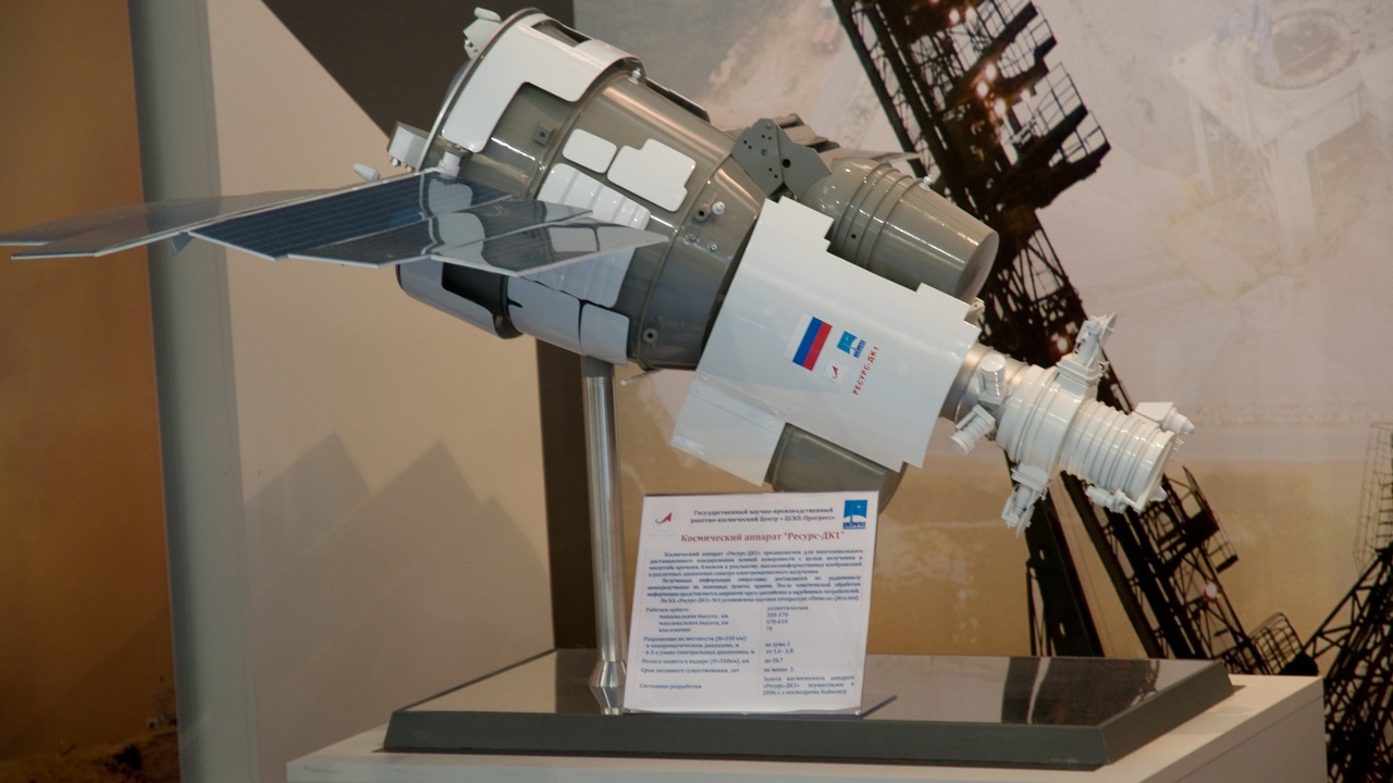 Satellite imagery on a laptop with a small drone on a field case used for environmental mapping