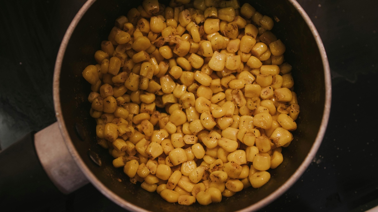 Kitchen workbench with traditional alkaline noodle ingredients and lab reagent bottles labeled potassium carbonate