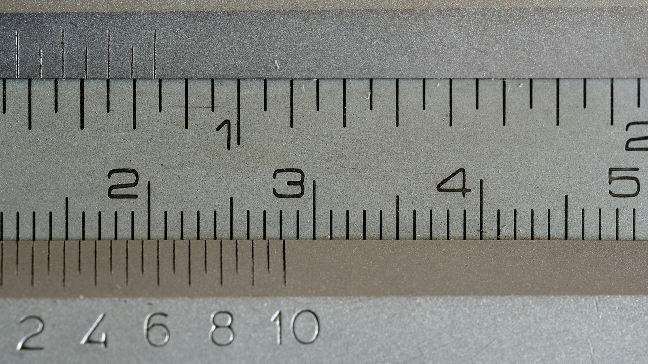 Desk with pencil, notebook, compass and ruler representing foundational math tools