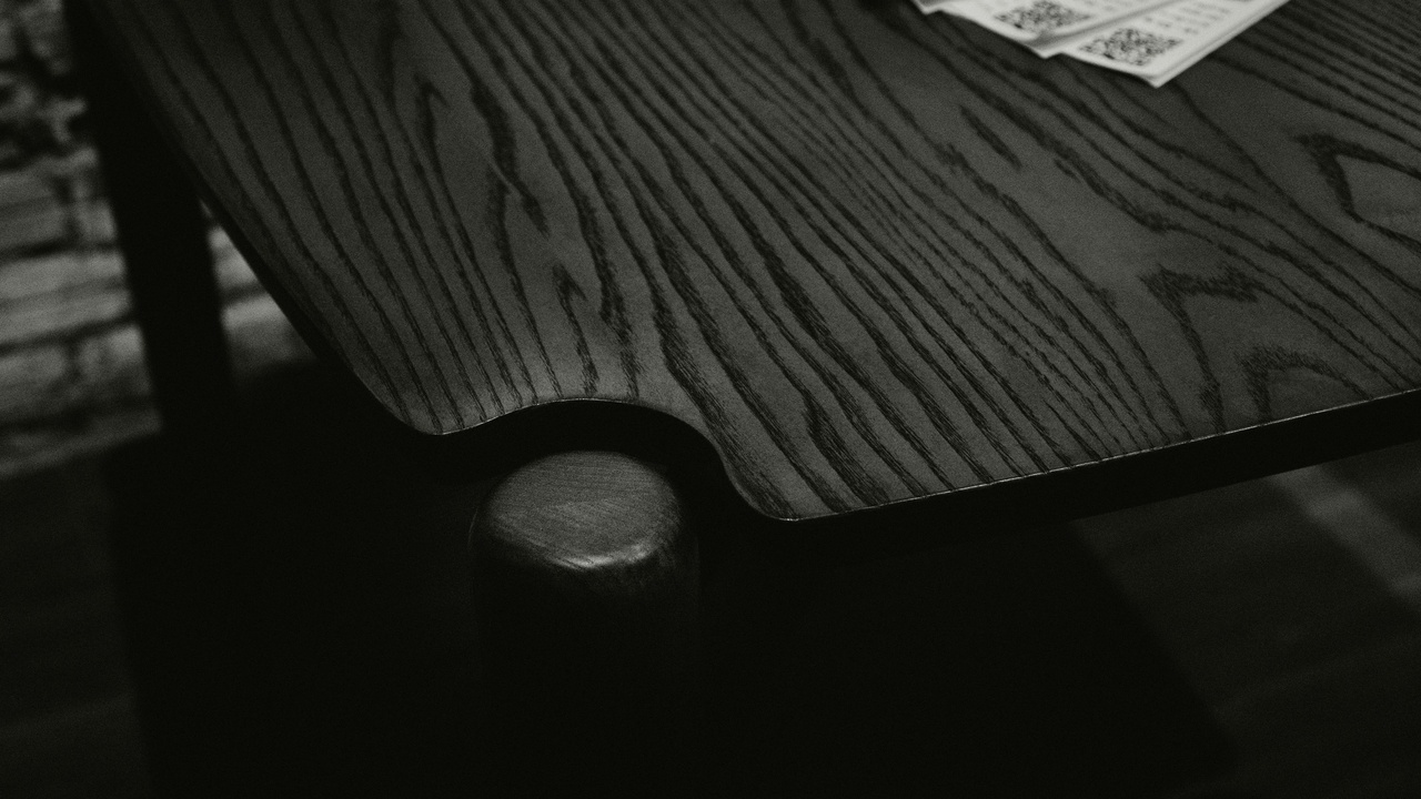 Tilt‑table and sled test rigs used to measure static and kinetic coefficients of friction in a materials lab.