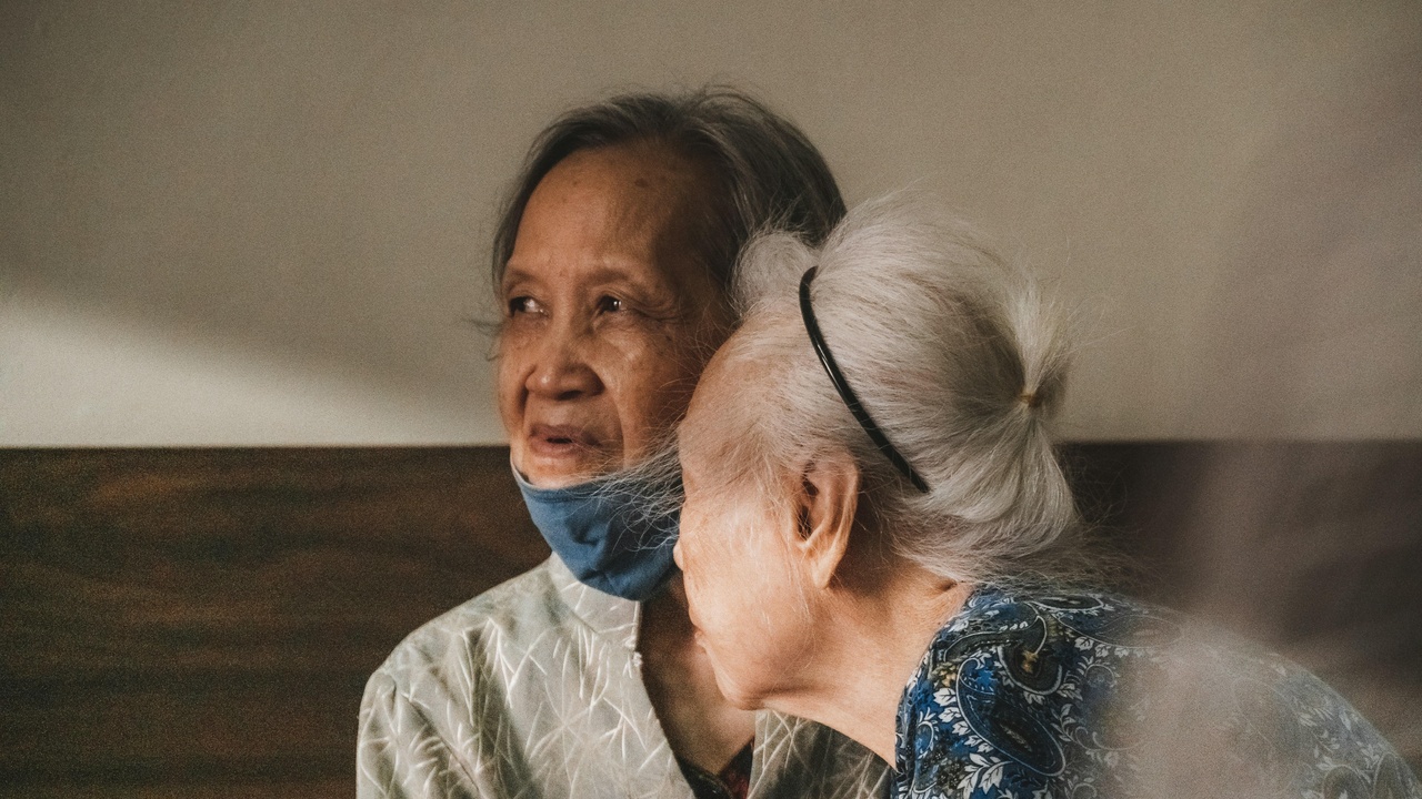 Older adults socializing in community center and exercising outdoors