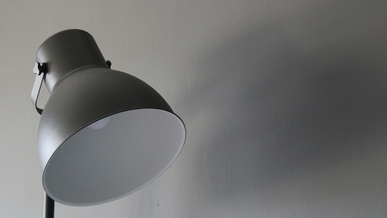 Close-up of a projector lamp and maintenance tools