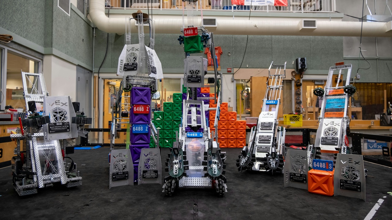 Robotic arms in an autonomous chemistry lab conducting high-throughput experiments.