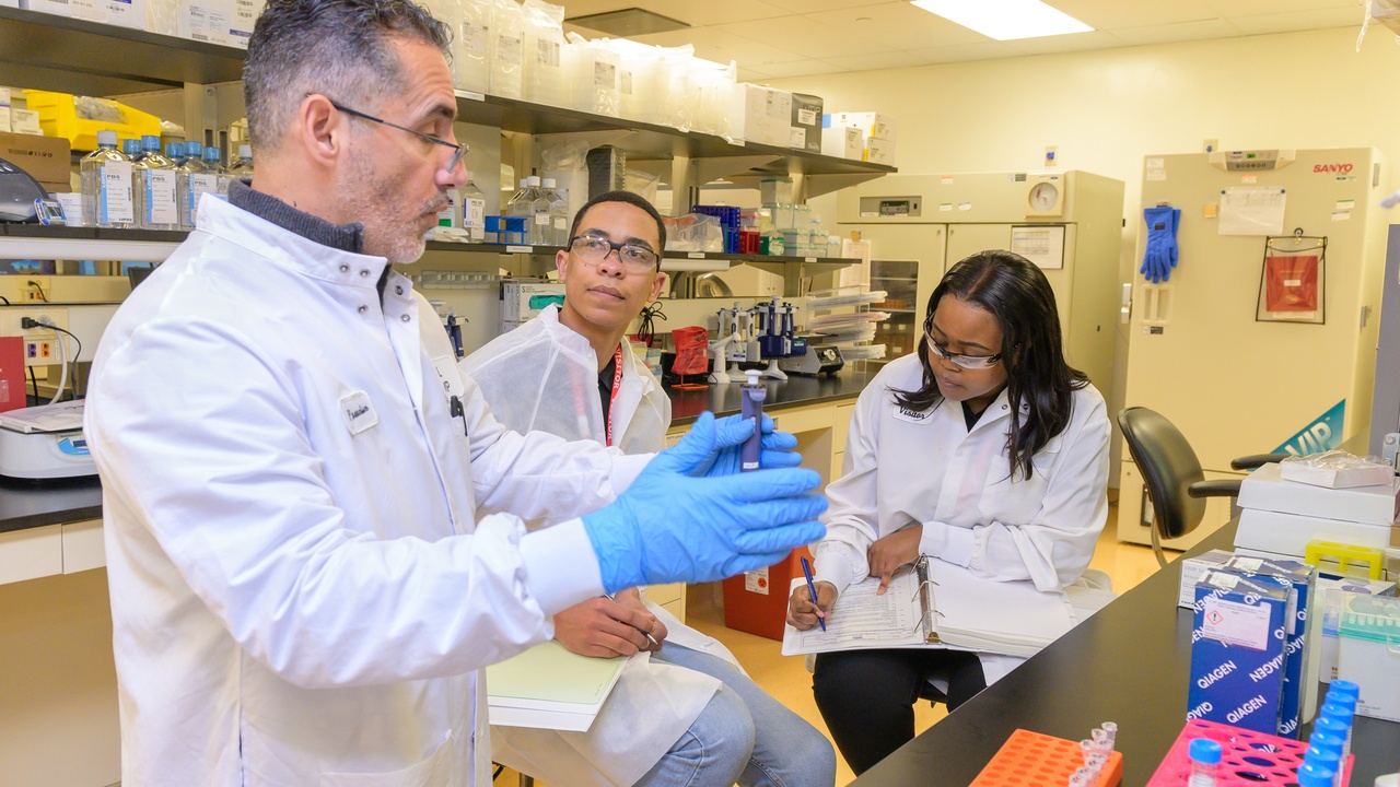 Lab scientist preparing lipid nanoparticles for mRNA vaccine research.