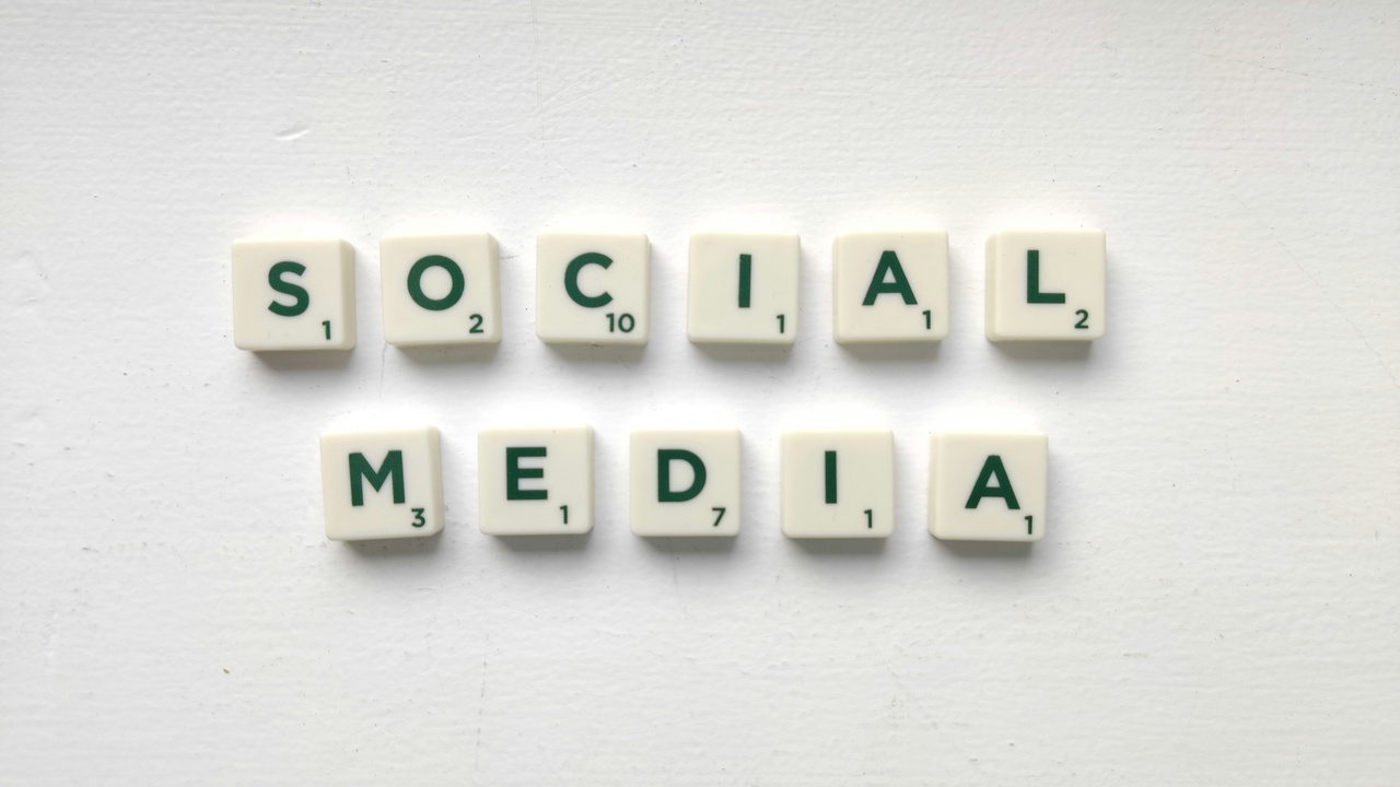 Social media icons and protest signs illustrating the spread of vaccine-related misinformation.