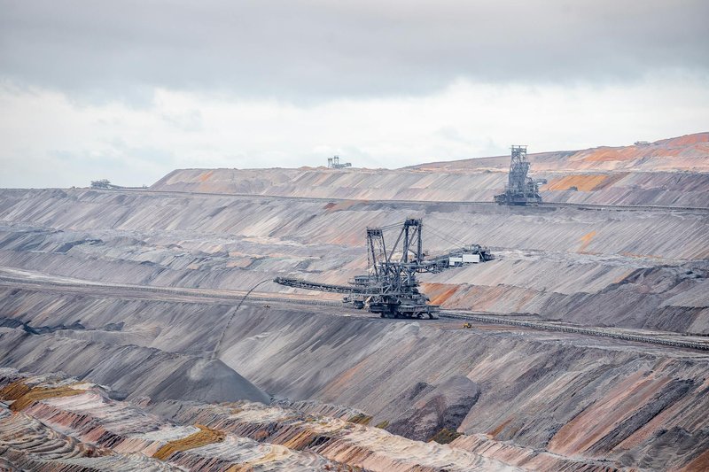 Aerial view of bucket-wheel excavators in an expansive open-pit coal mine.