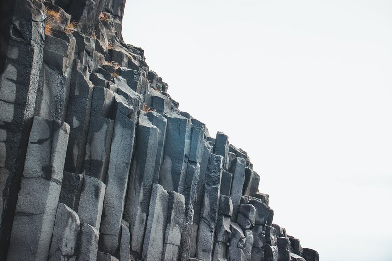 Impressive basalt columns create a dramatic landscape in Iceland, showcasing nature's geometric beauty.