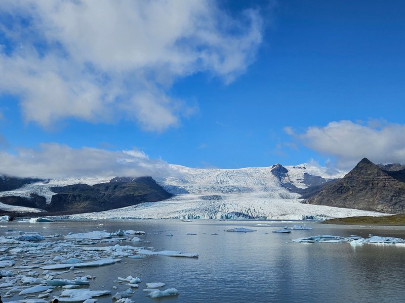 A breathtaking view of the Vatnajökull glacier under a clear blue sky in Iceland.