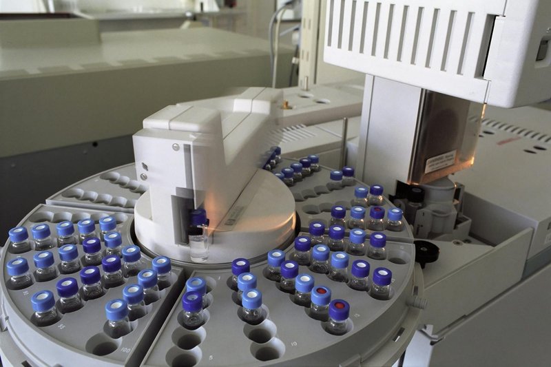 High-tech laboratory equipment with multiple vials in a scientific research facility.