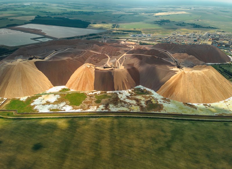 A breathtaking aerial view of salt mounds and plains in Soligorsk, Belarus, showcasing industrial salt production.