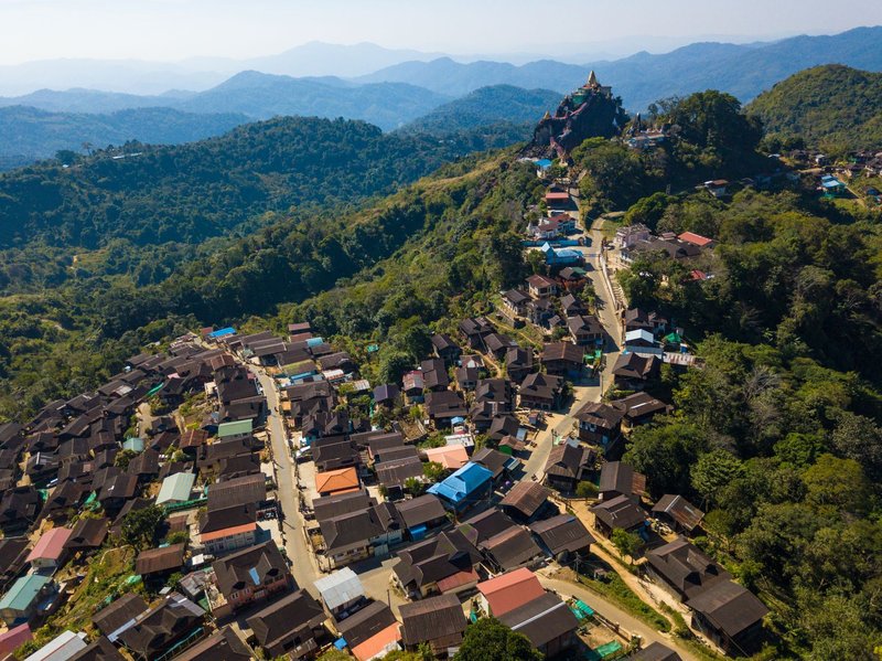 A stunning aerial view of Mogok town, nestled in Myanmar's lush mountains.