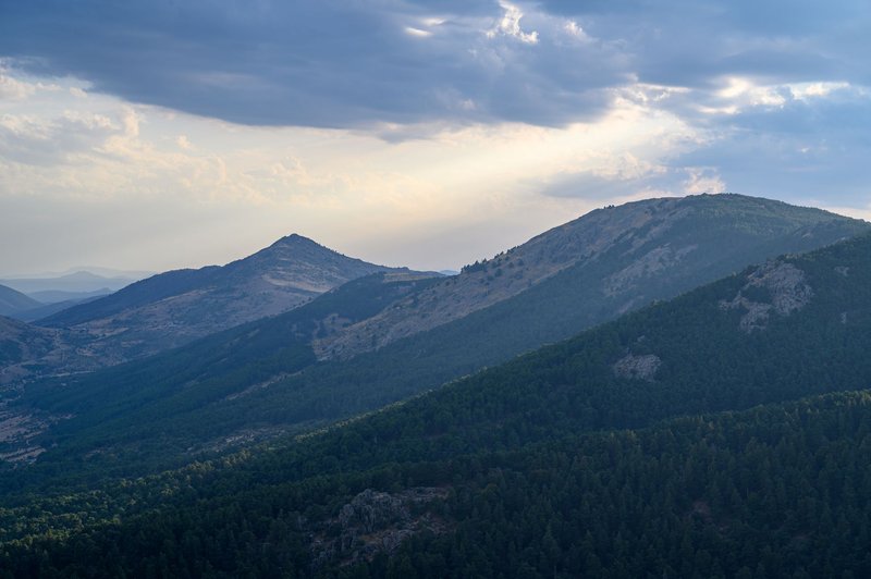 Breathtaking view of Spanish mountains under a dramatic sky, showcasing natural beauty.