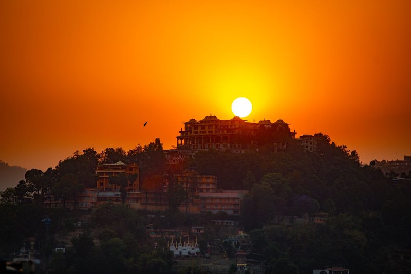 A breathtaking sunset view over the Swayambhunath Stupa in Kathmandu, Nepal.