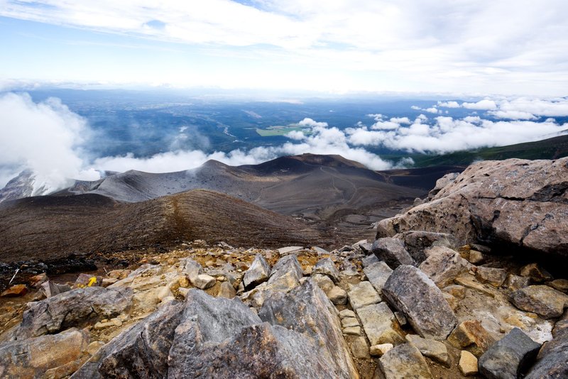 Explore the breathtaking volcanic terrain and expansive cloudscapes of Biei, Hokkaido.