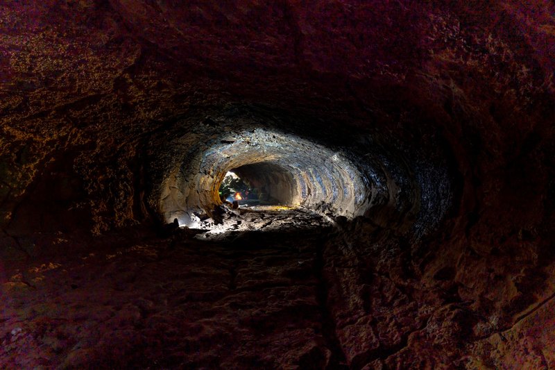 Explore the fascinating textures and formations inside a natural lava tube cave.