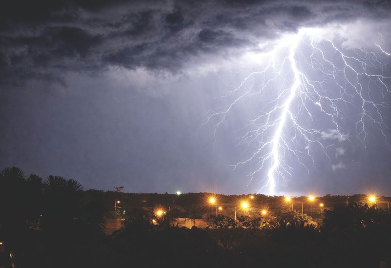 A vivid lightning strike illuminates the night sky over Palmas, Tocantins, Brazil.