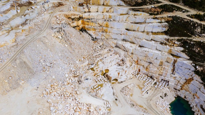 Stunning aerial shot of a marble quarry in Thessaloniki, Greece showcasing the intricate patterns and colors.