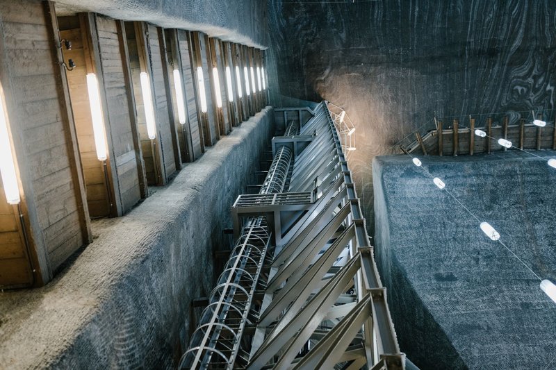 Metal constructions and LED lamps in underground hall of Salina Turda salt mine in Romania