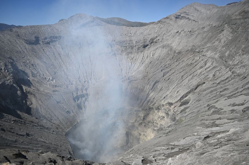 A high-resolution view of a smoking volcanic crater exhibiting raw natural beauty.