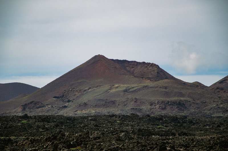 Explore the breathtaking volcanic landscape of Timanfaya National Park in Lanzarote, Spain.
