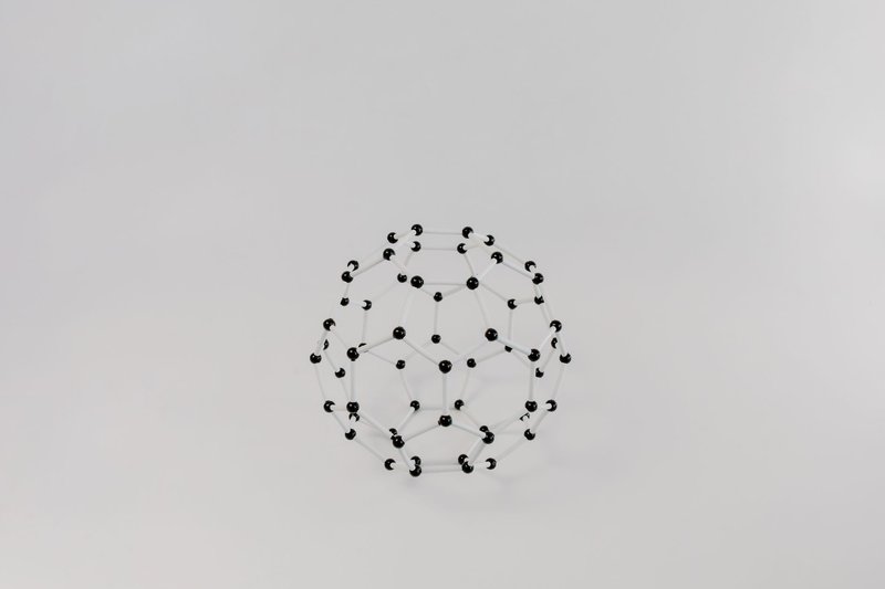 Abstract geometric molecular model with hexagons on white background.