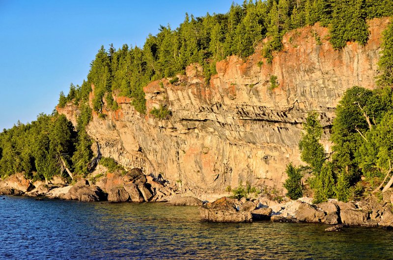 Beautiful cliffs and clear blue water at sunset in Northern Bruce Peninsula, Ontario, Canada.