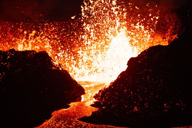 Captivating image of a powerful volcanic eruption with glowing lava and intense heat.