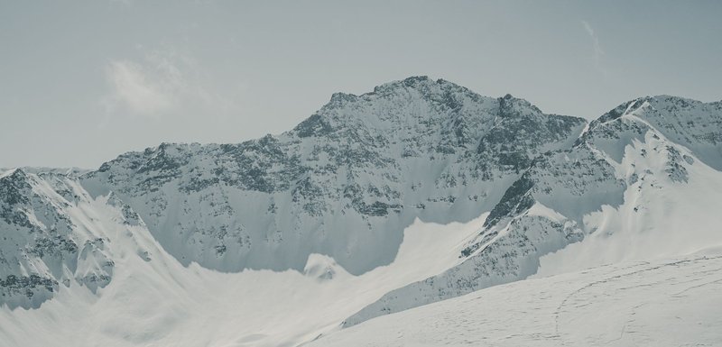 Scenic winter view of snow-covered mountains in Graubünden, Switzerland.